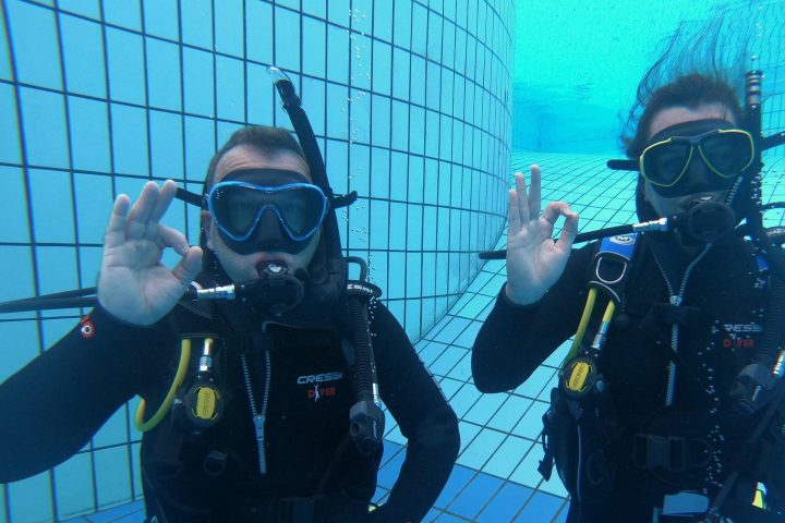 a couple of people that are standing in the snow