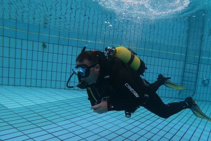 a person riding a snowboard down a snow covered mountain
