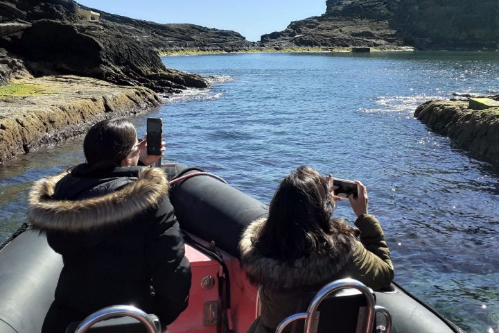 a couple of people that are sitting in the water
