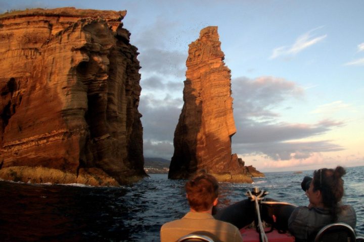 a group of people in front of a body of water