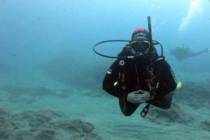 a man swimming in a body of water