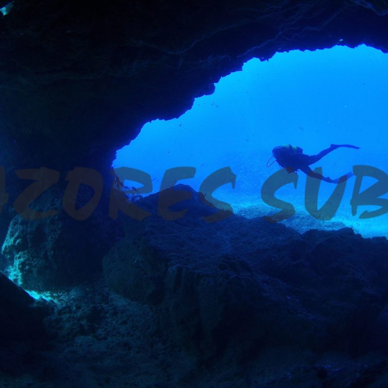 a person swimming in the dark