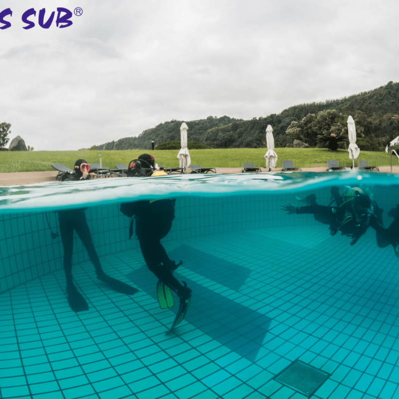 a group of people in a pool of water